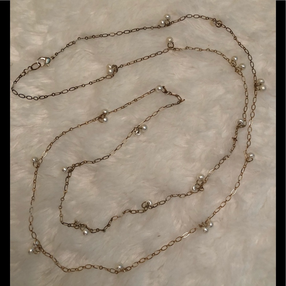 Delicate, long pearl necklace